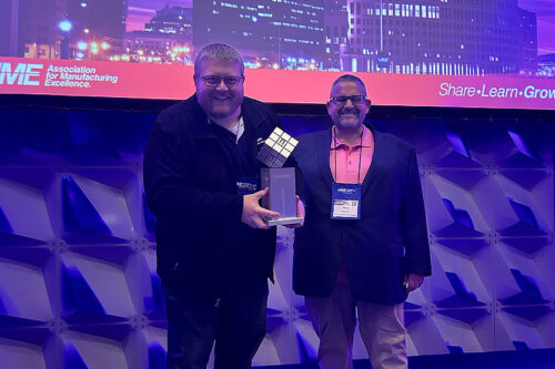 From left: Ryan Biddix, continuous improvement manager at Lenoir; and Mark Parsons, operations manager, Lenoir, receiving the award at the Annual AME Conference in Cleveland, Ohio, yesterday. (Photo: Business Wire)